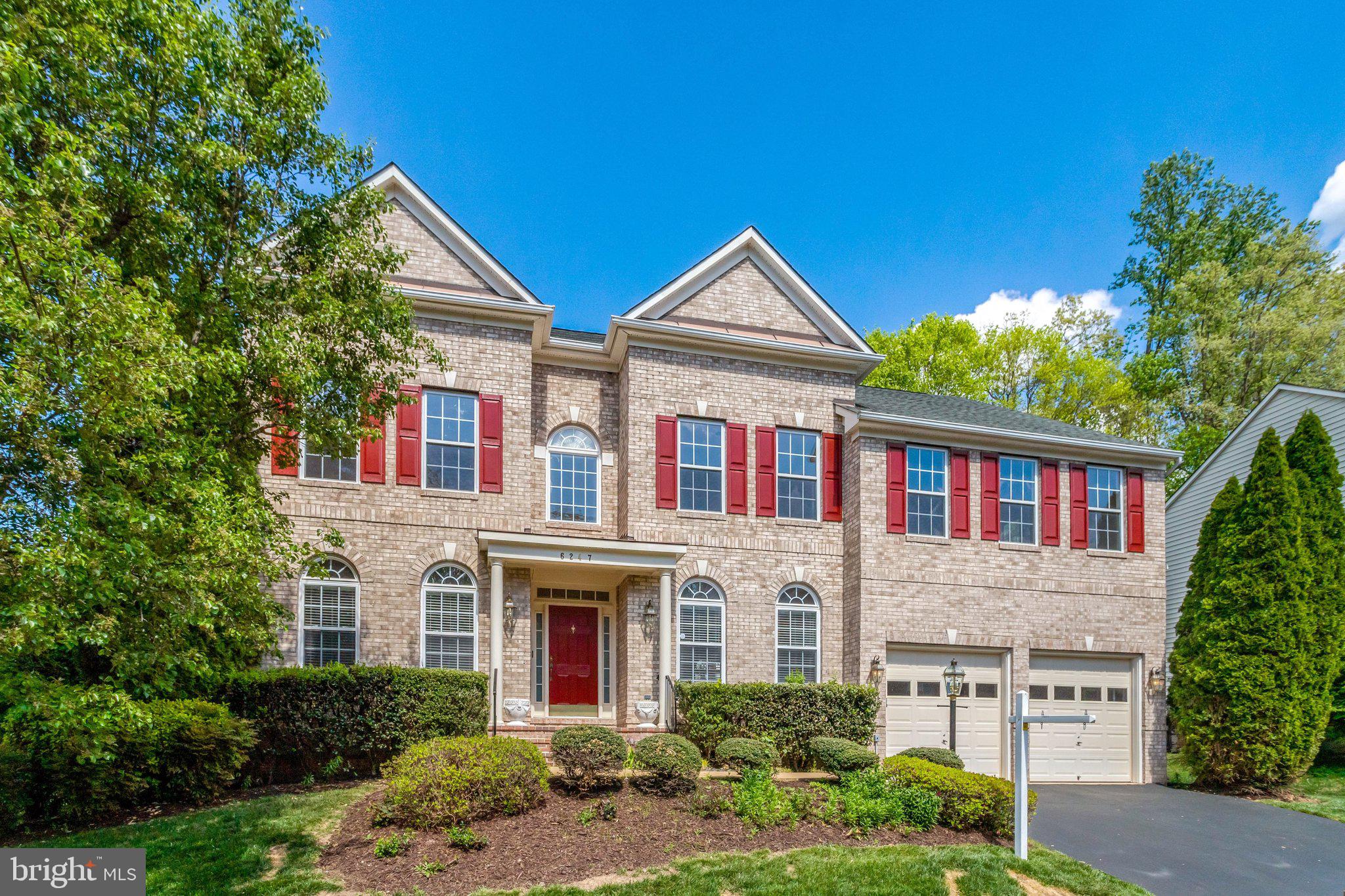 6247 Rolling Spring Court Springfield, VA 22152 - Photo 1 of 52 a front view of a house with garden