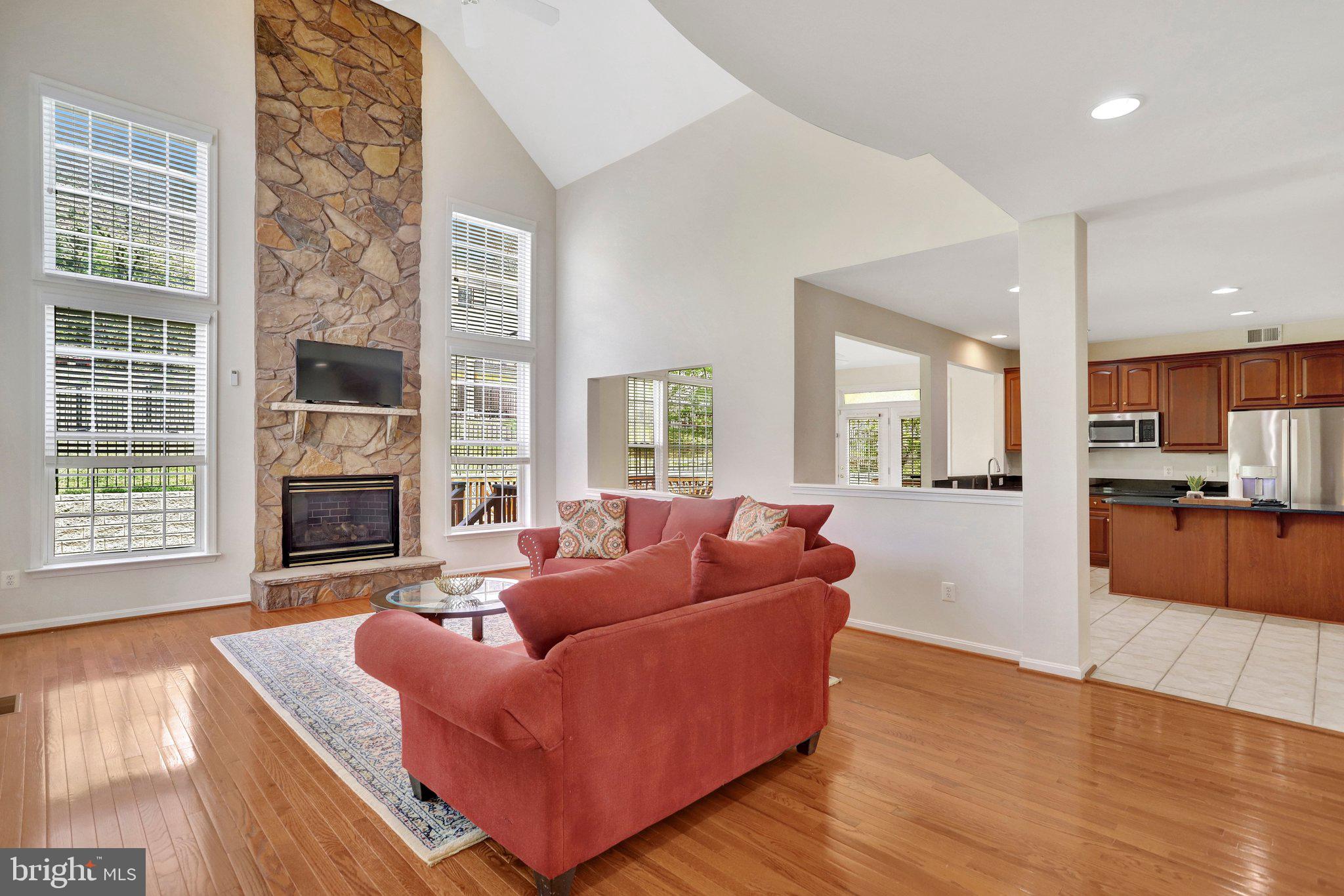 6247 Rolling Spring Court Springfield, VA 22152 - Photo 13 of 52 a living room with furniture and a fireplace