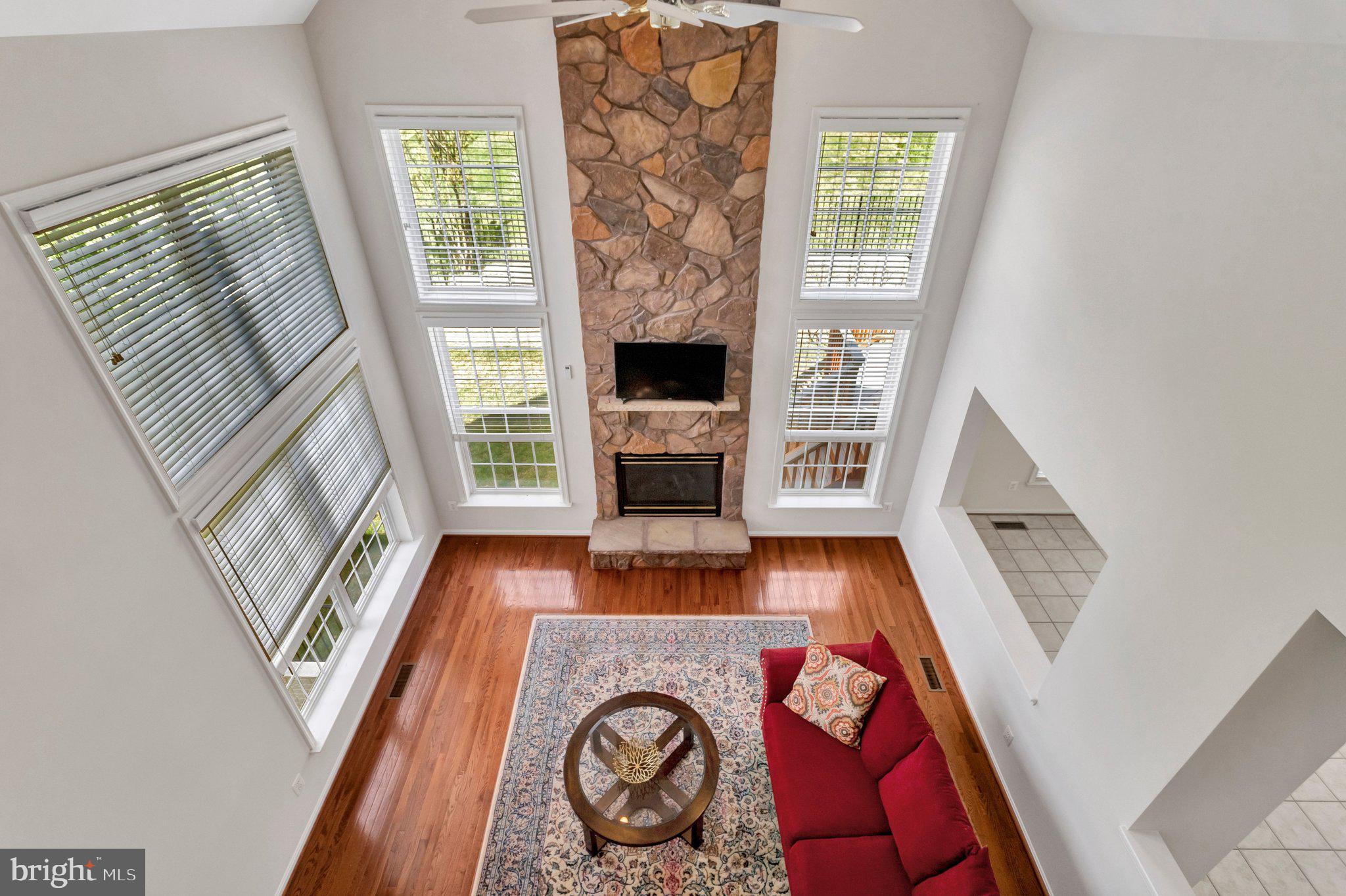 6247 Rolling Spring Court Springfield, VA 22152 - Photo 14 of 52 a view of living room with furniture and a fireplace