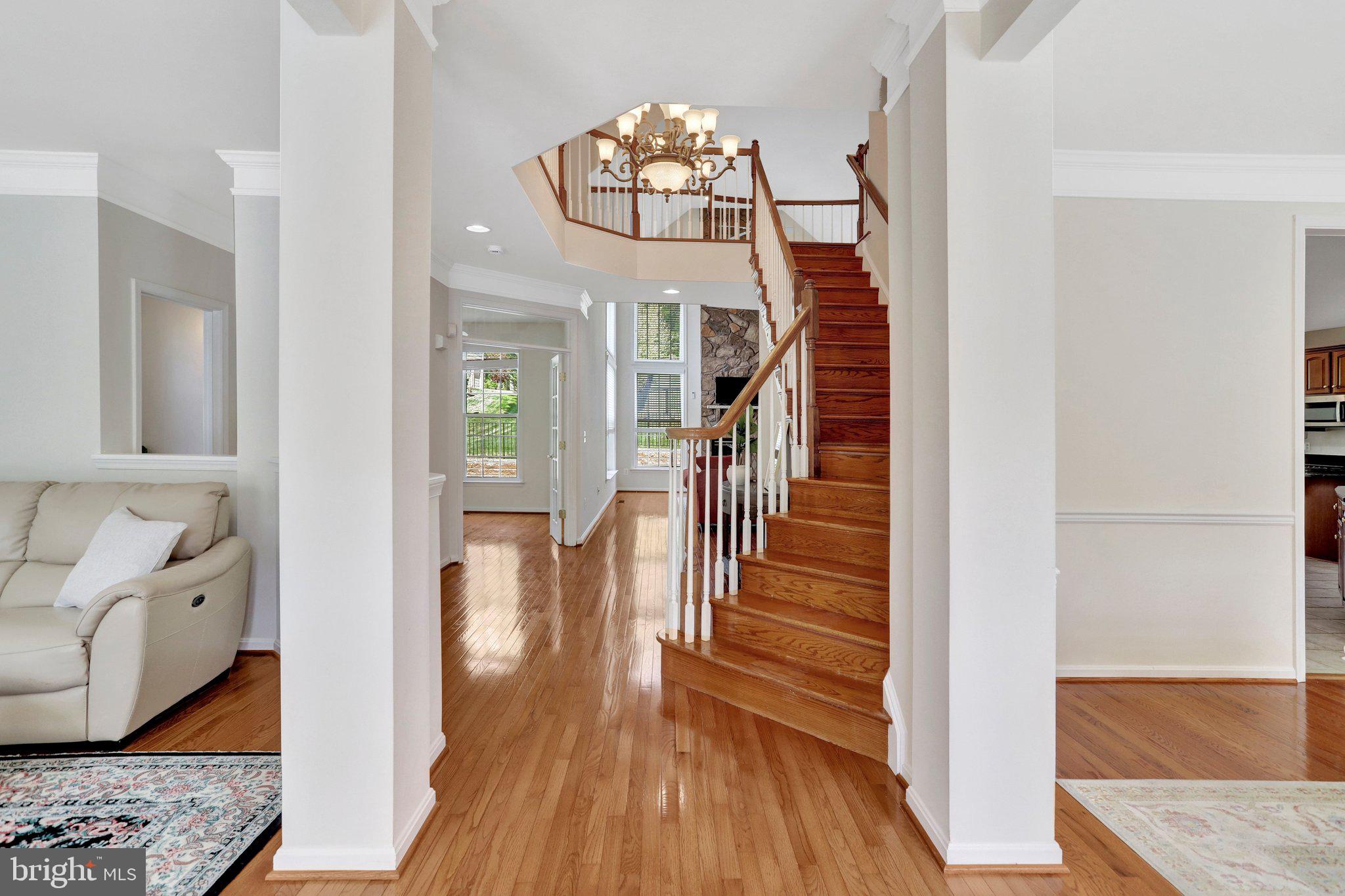 6247 Rolling Spring Court Springfield, VA 22152 - Photo 3 of 52 a view of a hallway view with wooden floor and staircase
