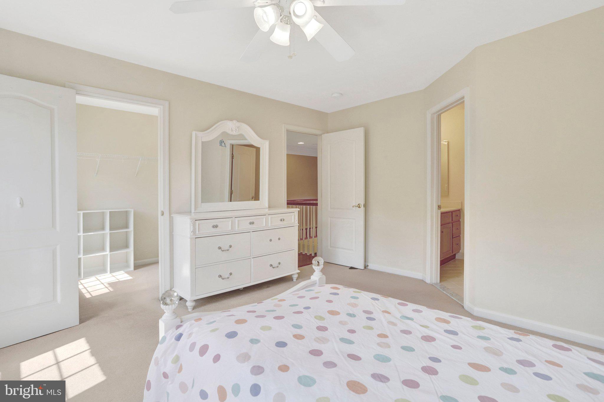 6247 Rolling Spring Court Springfield, VA 22152 - Photo 31 of 52 a bedroom with a bed and a dresser