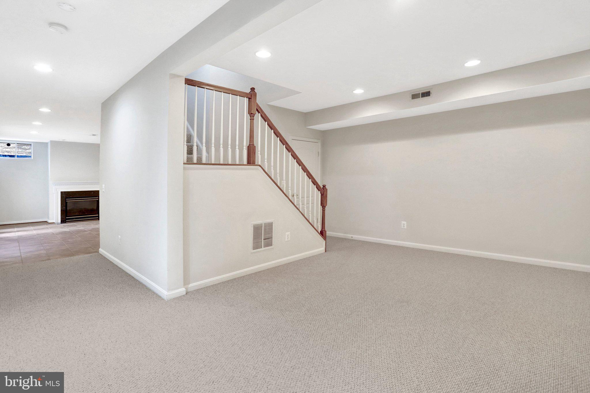 6247 Rolling Spring Court Springfield, VA 22152 - Photo 39 of 52 a view of an empty room with stairs