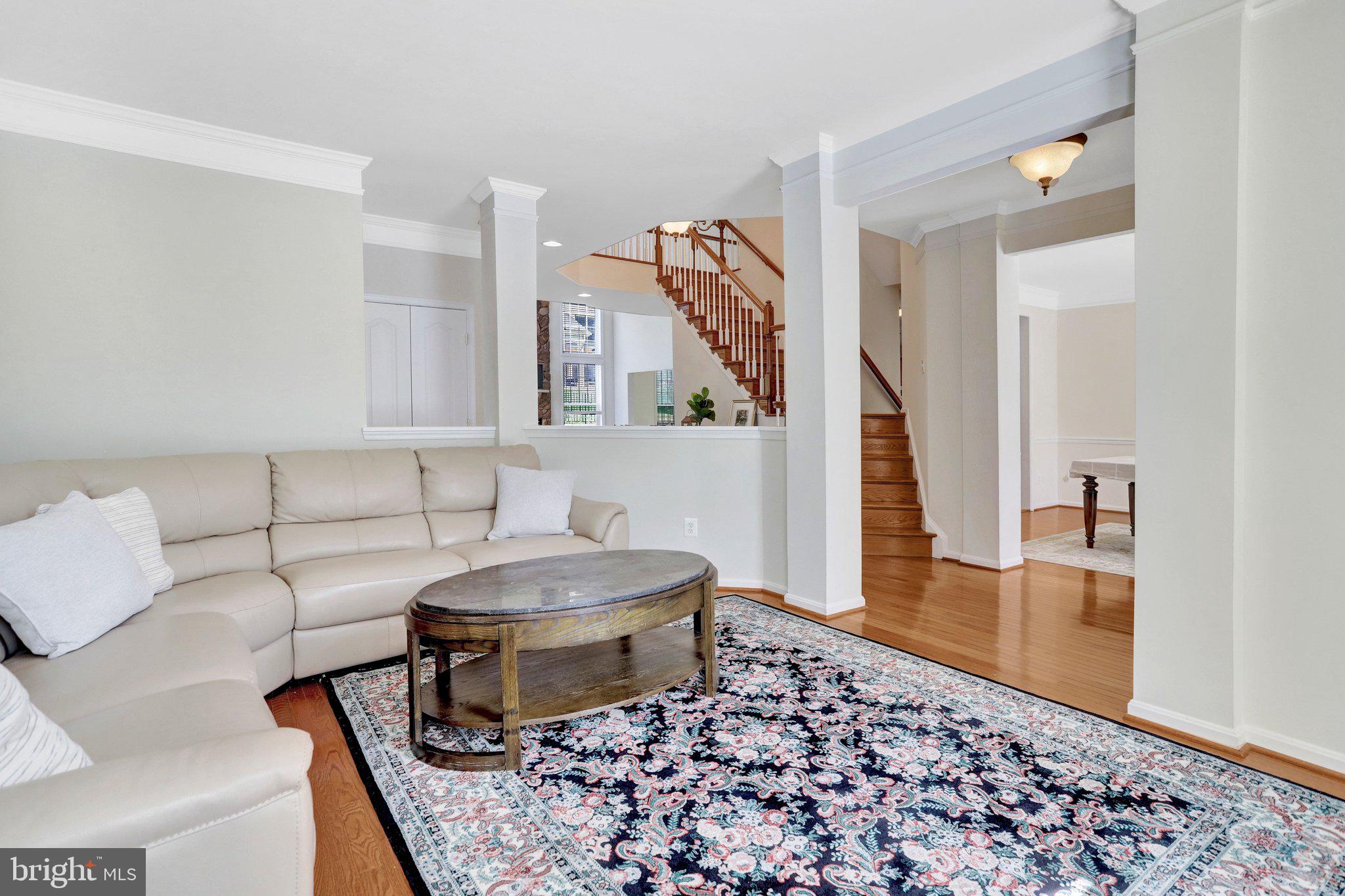6247 Rolling Spring Court Springfield, VA 22152 - Photo 5 of 52 a living room with a couch and a rug