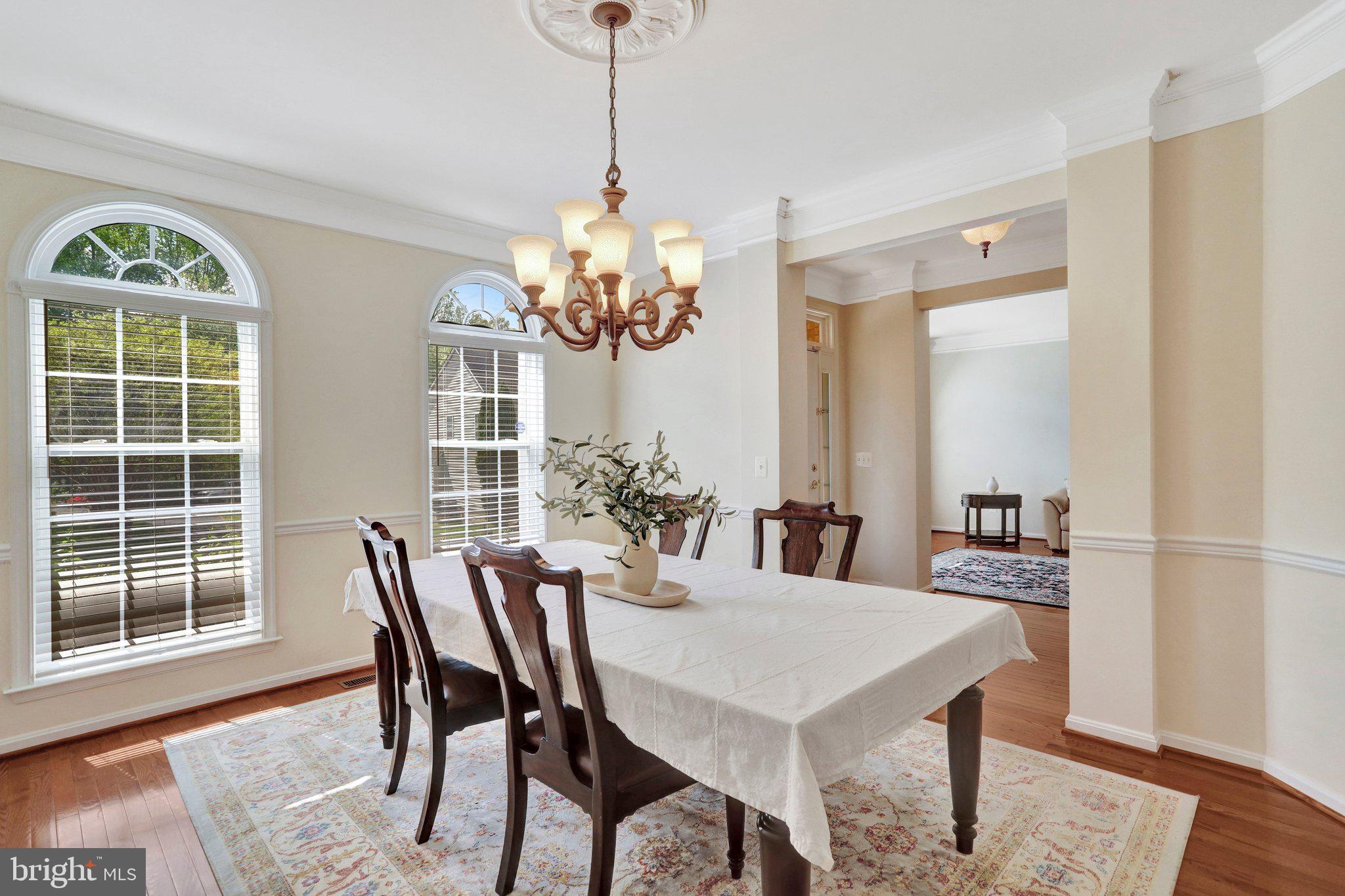 6247 Rolling Spring Court Springfield, VA 22152 - Photo 7 of 52 a view of a dining room with furniture window and wooden floor
