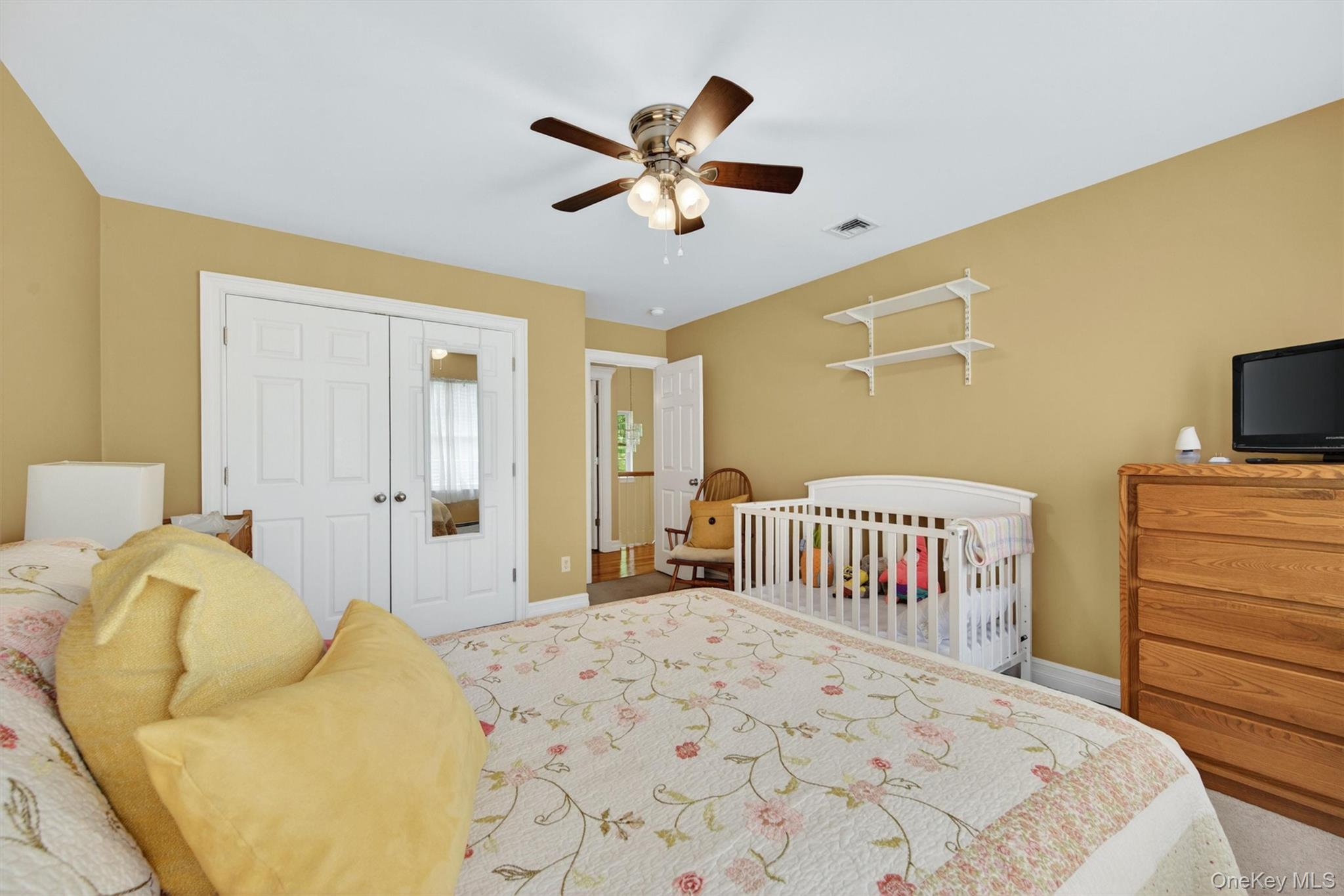 19 Pirog Road Pine Bush, NY 12566 - Photo 30 of 50 a bedroom with a bed and a chandelier