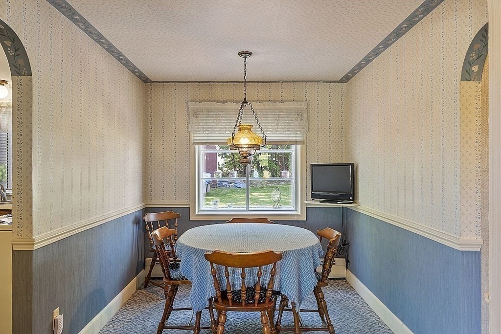 338 Donohue Road Dracut, MA 01826 - Photo 13 of 38 a view of a dining room with furniture window and outside view