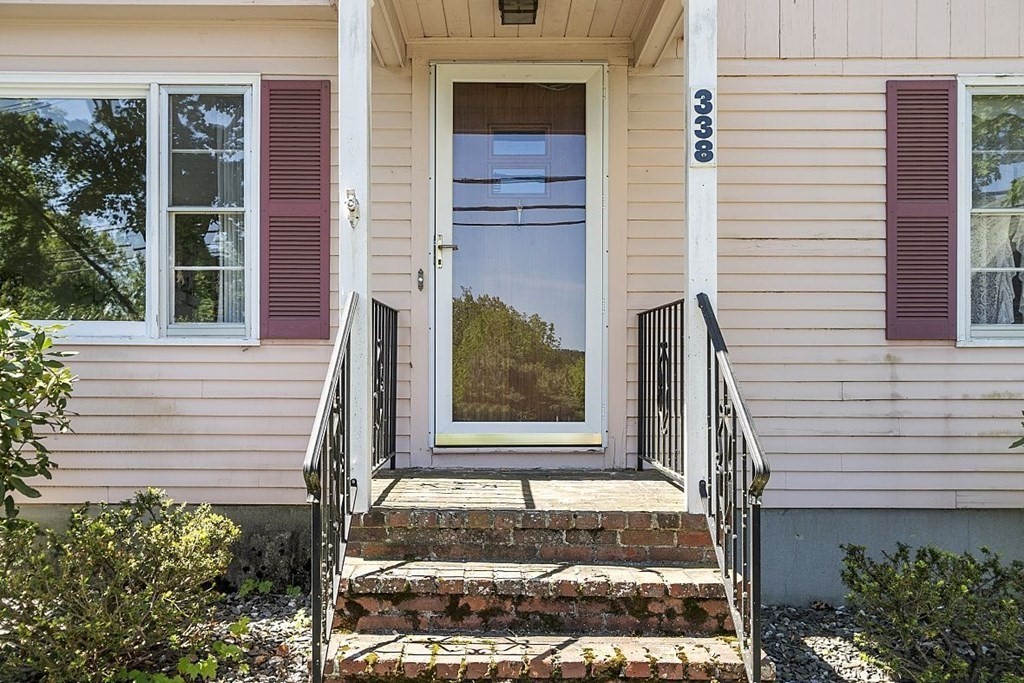 338 Donohue Road Dracut, MA 01826 - Photo 2 of 38 a front view of a house with a yard