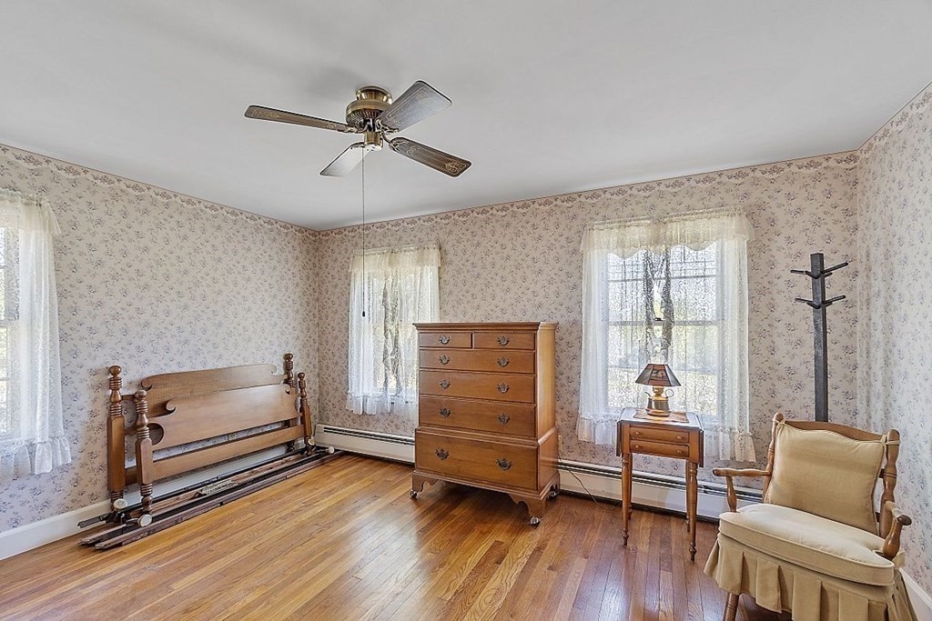 338 Donohue Road Dracut, MA 01826 - Photo 26 of 38 a bedroom with furniture and a window