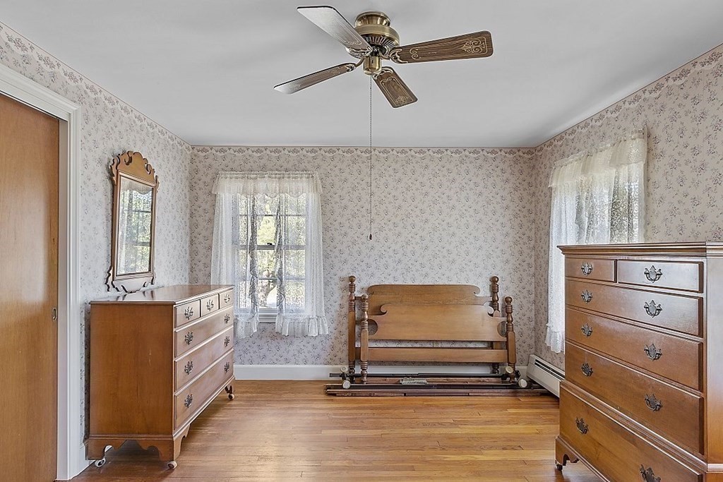 338 Donohue Road Dracut, MA 01826 - Photo 28 of 38 a room with furniture and chandelier fan