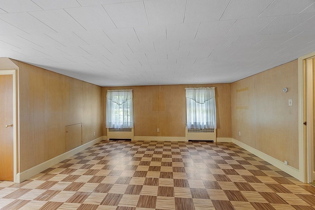 338 Donohue Road Dracut, MA 01826 - Photo 29 of 38 a view of a big room with windows and chandelier fan