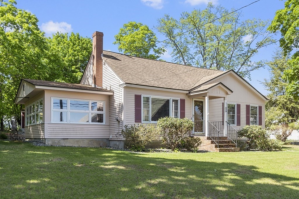 338 Donohue Road Dracut, MA 01826 - Photo 3 of 38 a view of a house with a yard