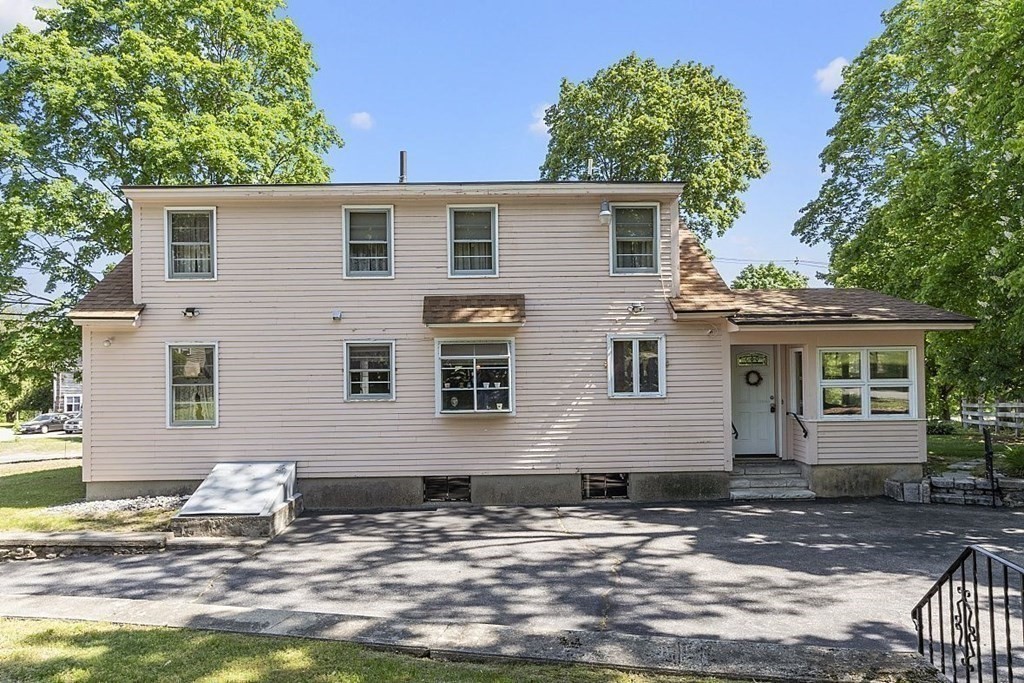 338 Donohue Road Dracut, MA 01826 - Photo 4 of 38 a view of a house with a yard