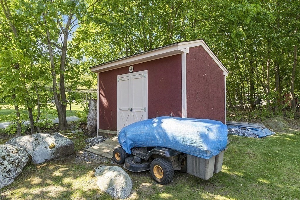338 Donohue Road Dracut, MA 01826 - Photo 6 of 38 a backyard of a house with table and chairs
