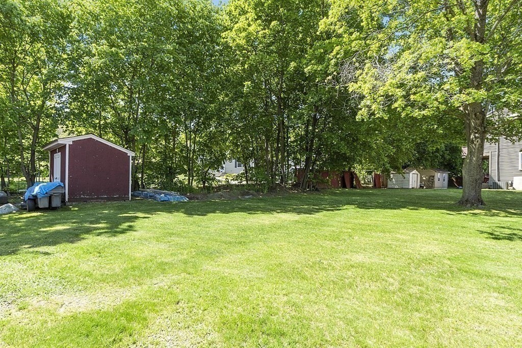 338 Donohue Road Dracut, MA 01826 - Photo 7 of 38 a fire hydrant in the middle of a field