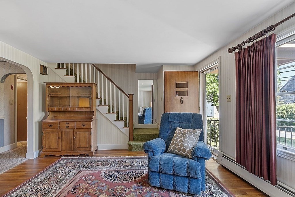 338 Donohue Road Dracut, MA 01826 - Photo 9 of 38 a living room with furniture and wooden floor