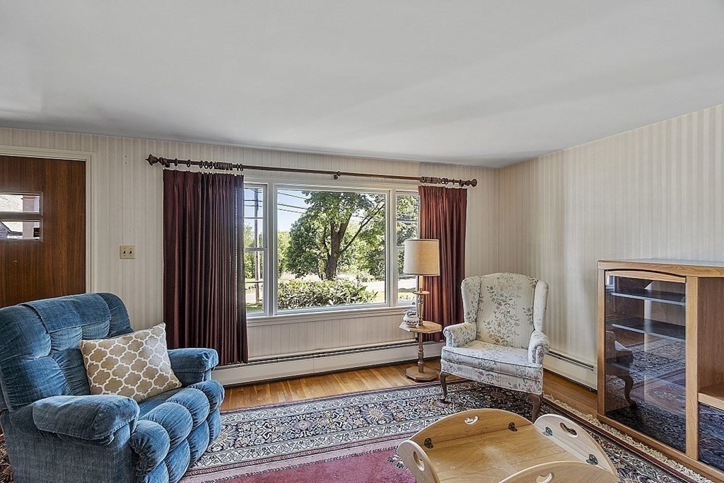 338 Donohue Road Dracut, MA 01826 - Photo 10 of 38 a living room with furniture and a window