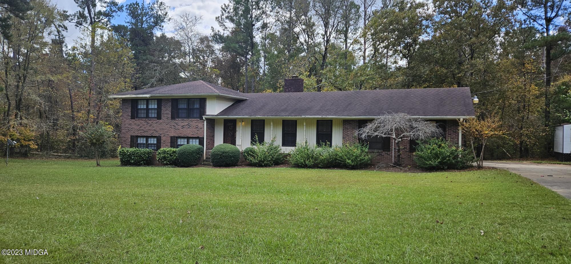 196 Candler Road Gray, GA 31032 - Photo 1 of 16 a front view of a house with yard and green space