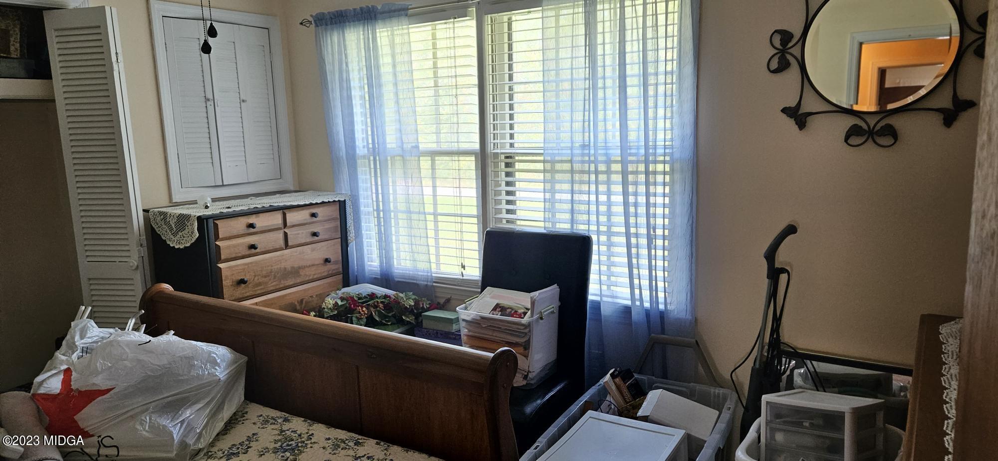 196 Candler Road Gray, GA 31032 - Photo 12 of 16 a living room with furniture and a window