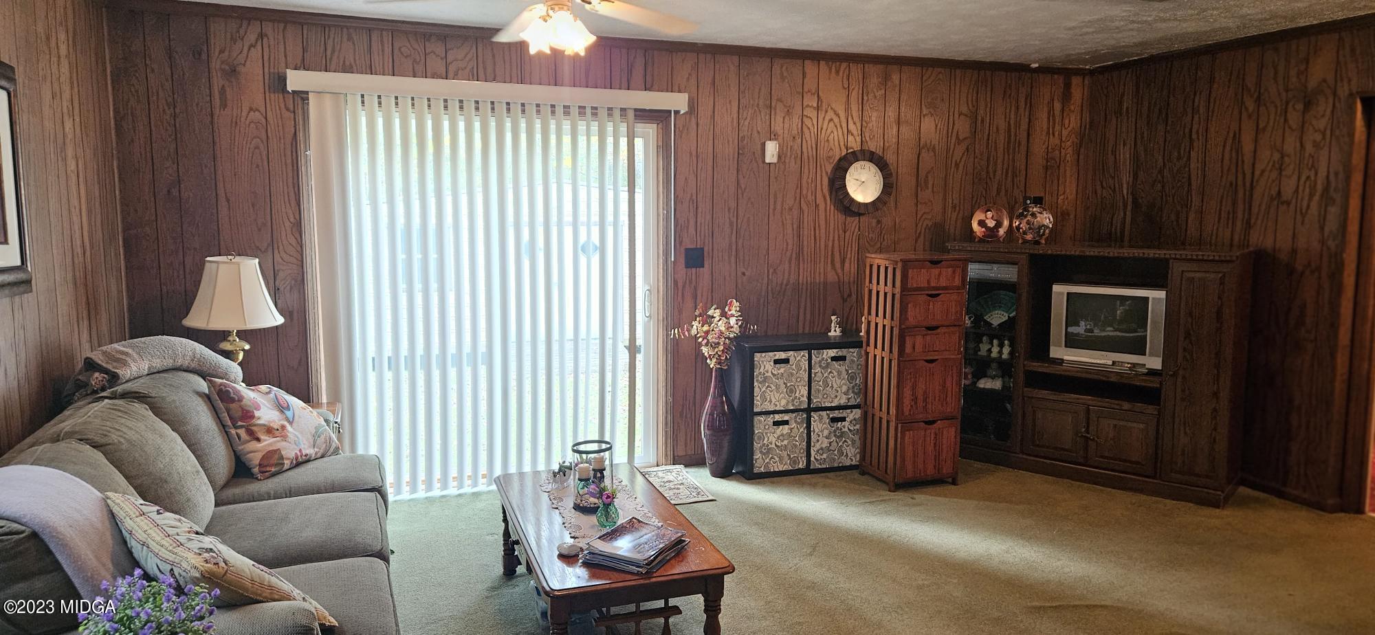 196 Candler Road Gray, GA 31032 - Photo 14 of 16 a living room with furniture and wooden floor