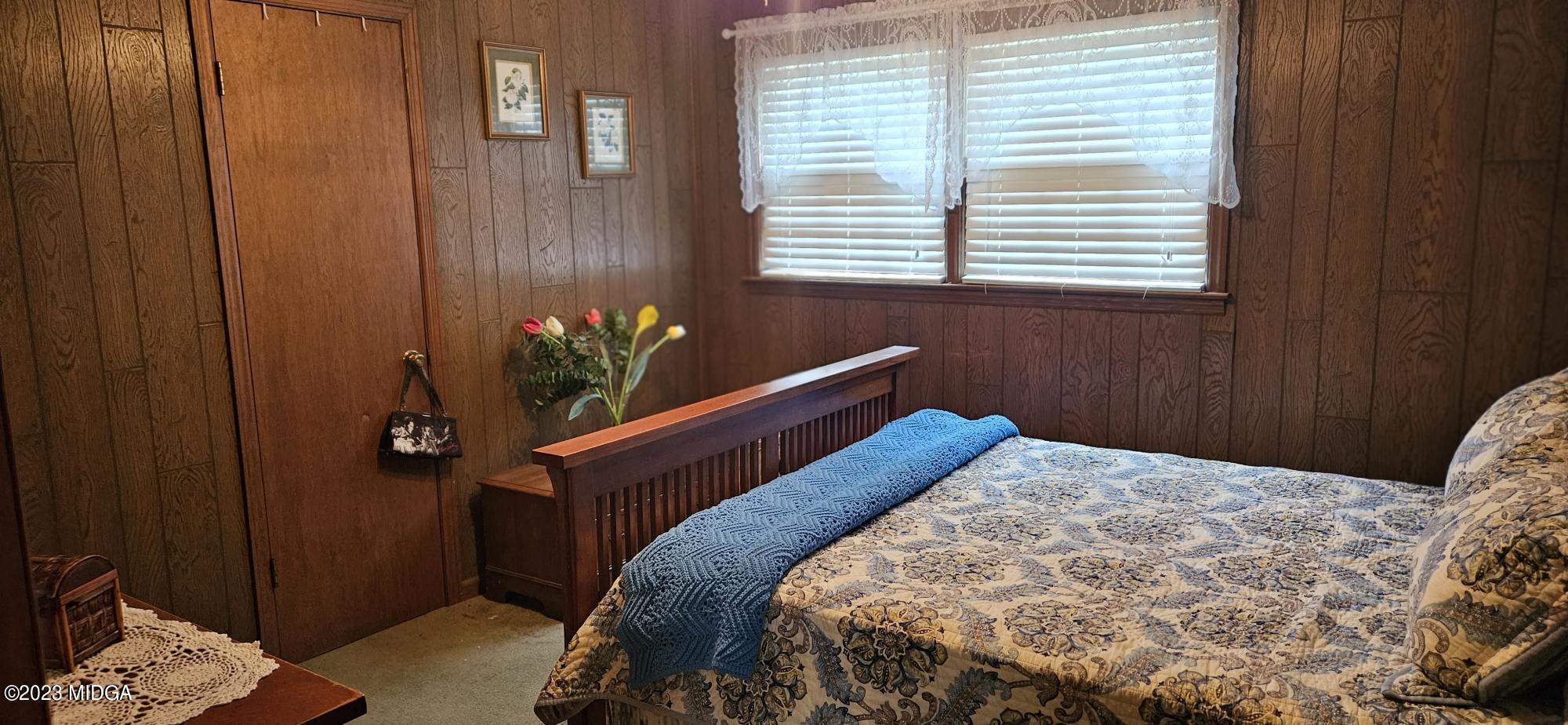 196 Candler Road Gray, GA 31032 - Photo 15 of 16 a bedroom with a bed and a window