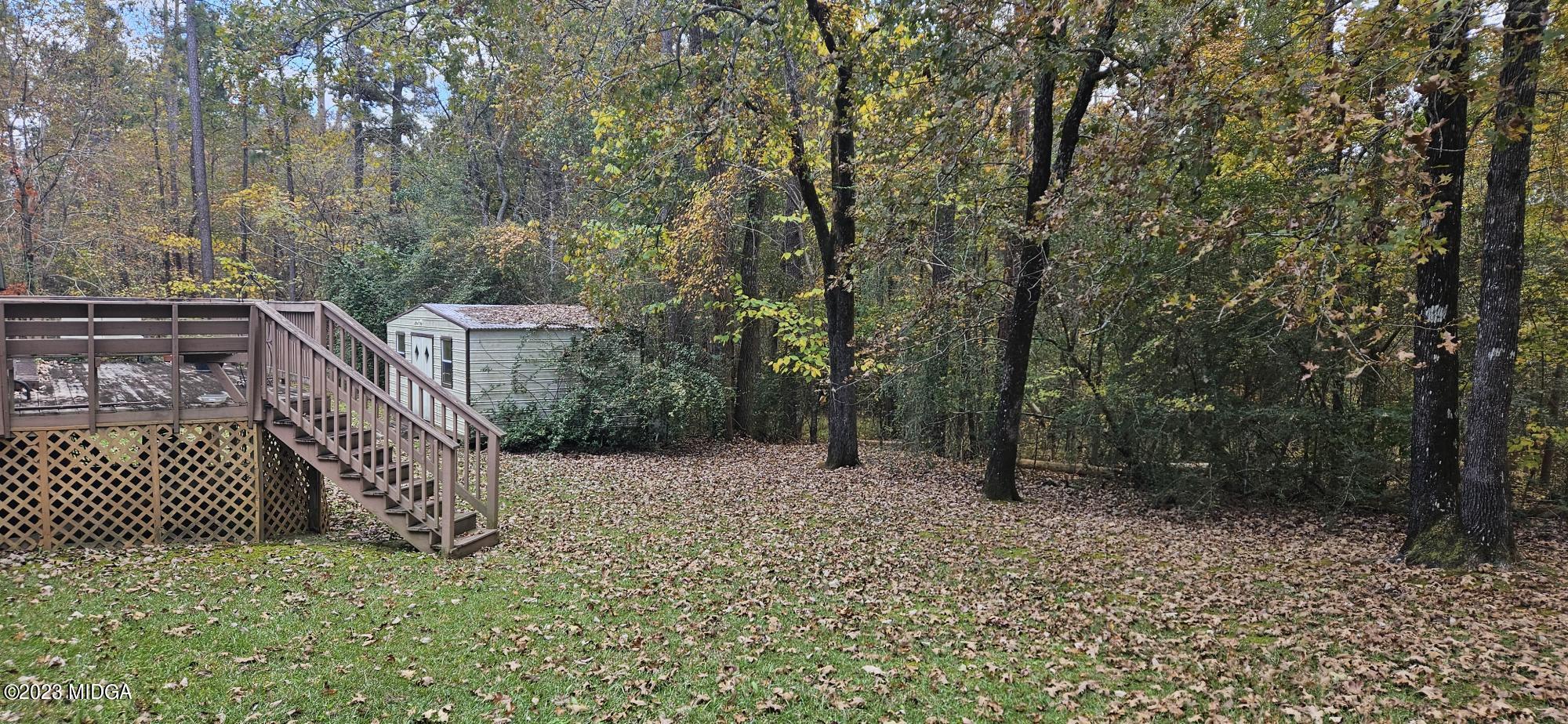 196 Candler Road Gray, GA 31032 - Photo 16 of 16 a backyard of a house with lots of green space