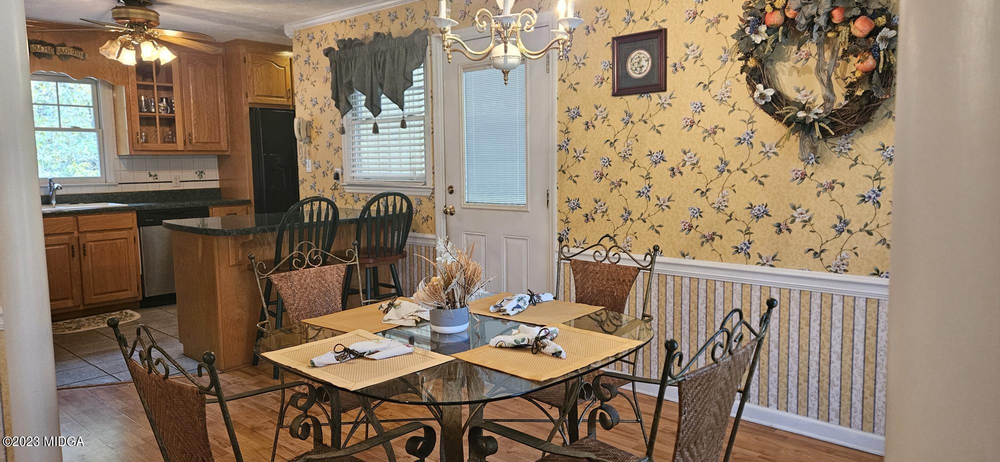 196 Candler Road Gray, GA 31032 - Photo 4 of 16 a view of a dining room with furniture and chandelier