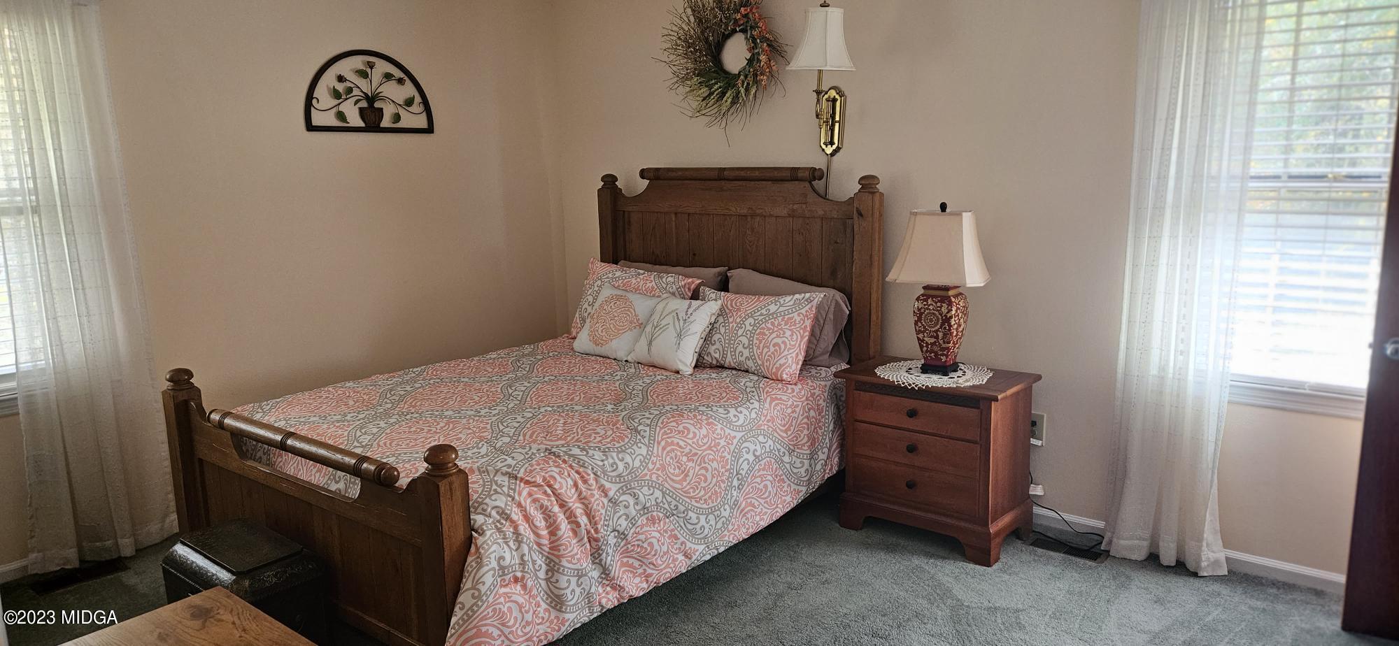 196 Candler Road Gray, GA 31032 - Photo 10 of 16 a bedroom with a bed and a window