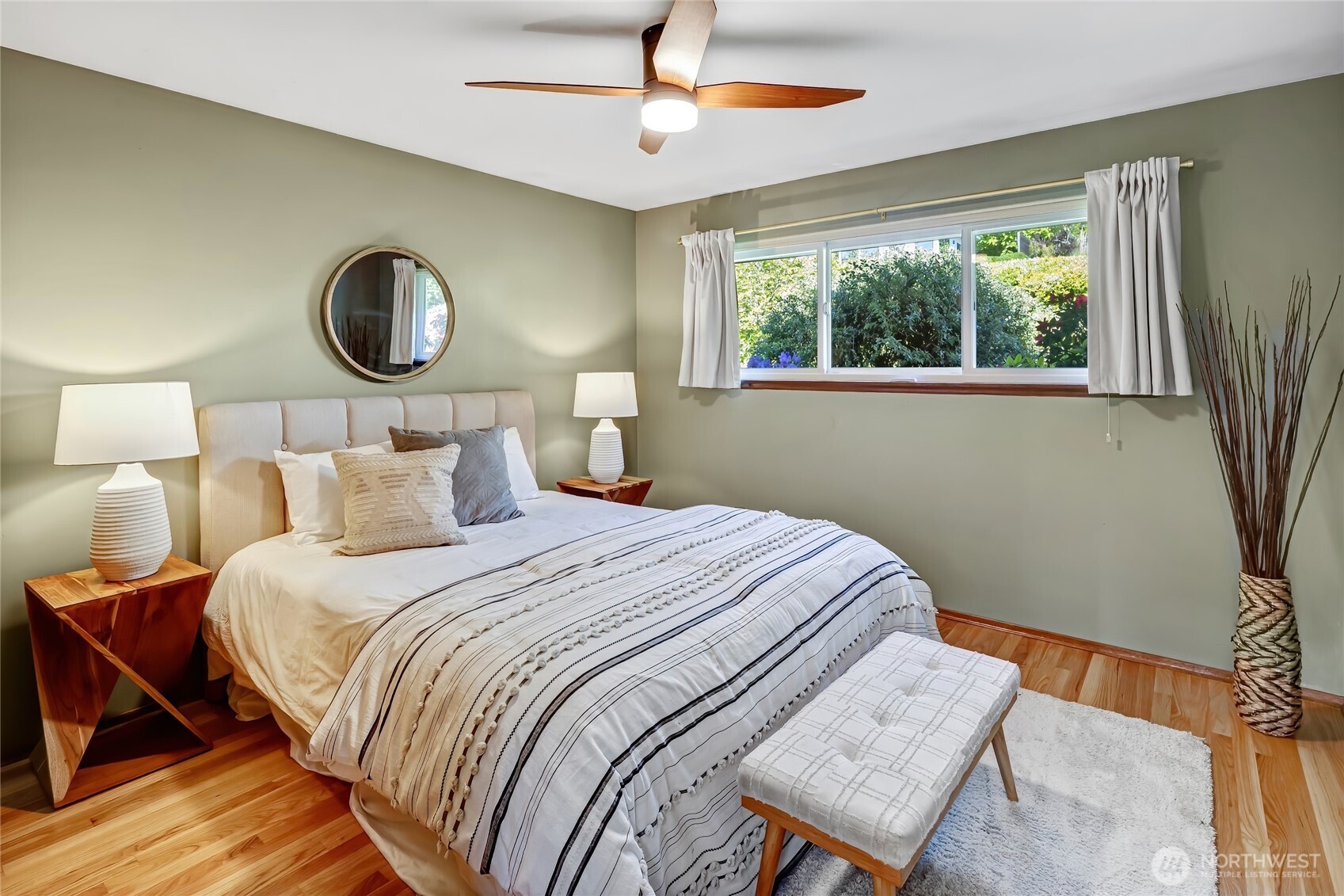 7571 45th Avenue Southwest Seattle, WA 98136 - Photo 19 of 40 a bedroom with a bed and window