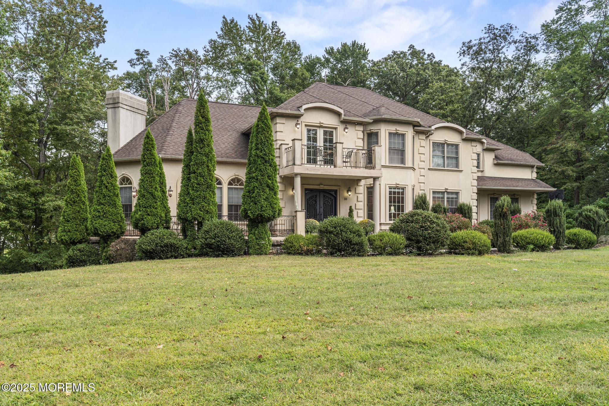 a front view of a house with a yard