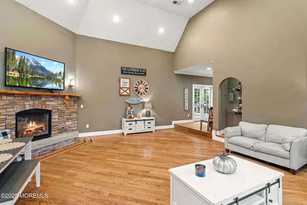 a living room with furniture and a fireplace