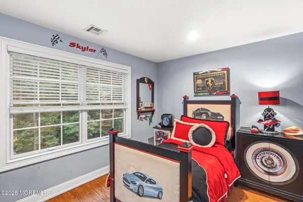 a utility room with a window and cabinets