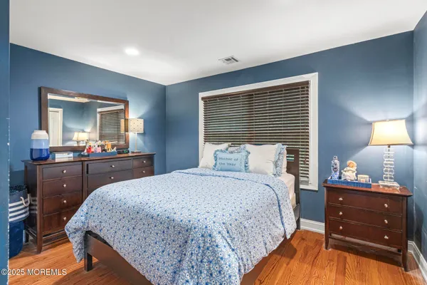 a bedroom with a bed and a closet