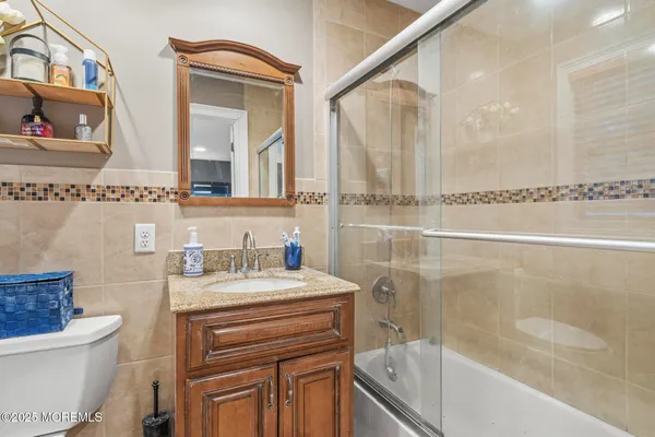 a bathroom with a sink a toilet and a bathtub