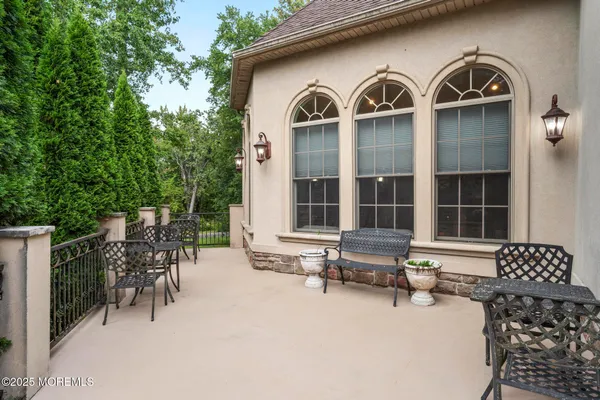 a front view of a house with outdoor seating