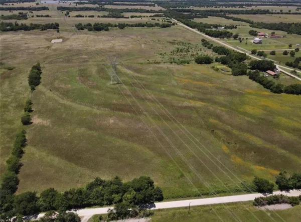 a view of a backyard of the house
