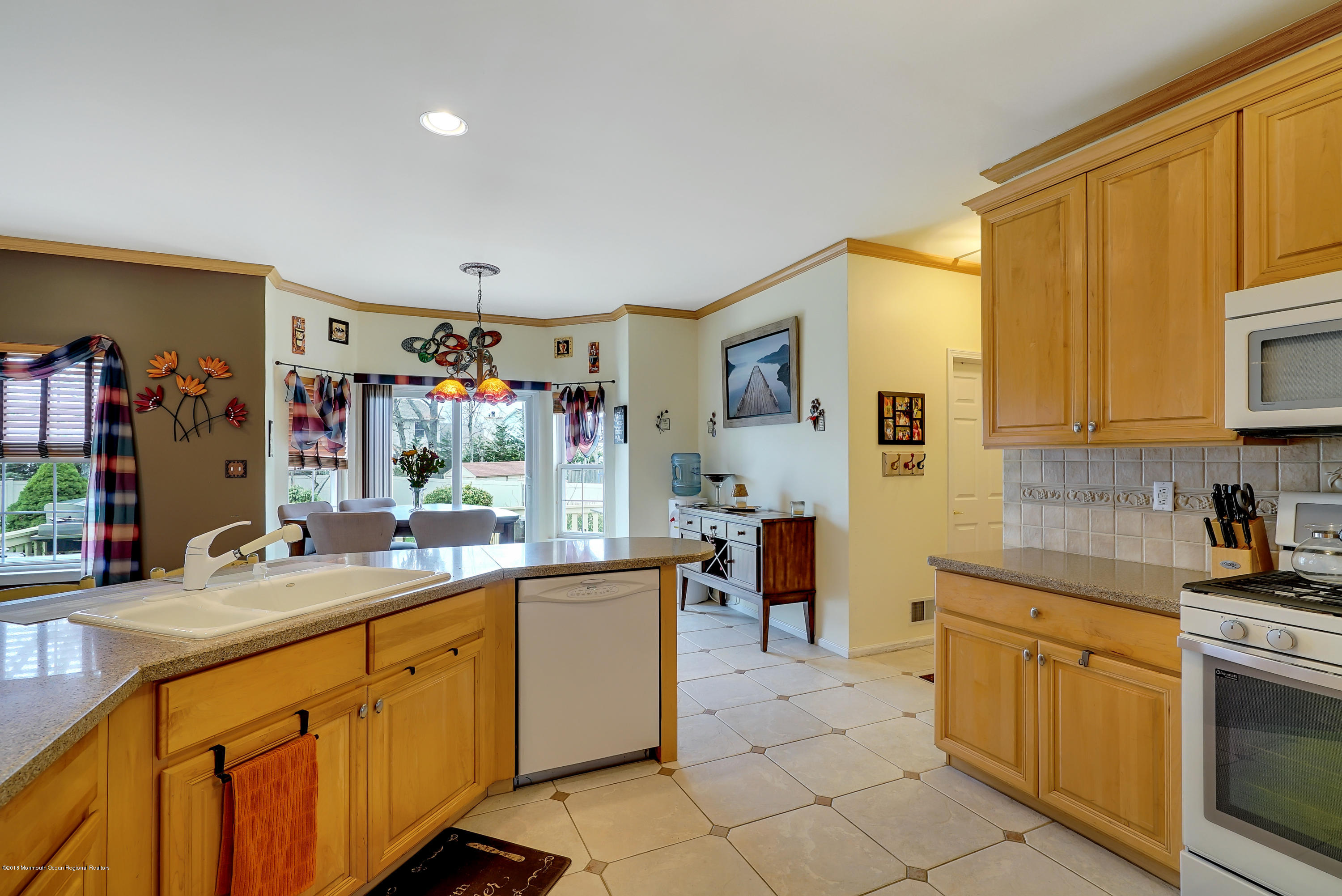 14 Judy Road Eatontown, NJ 07724 - Photo 18 of 38 a kitchen with stainless steel appliances a sink stove and cabinets