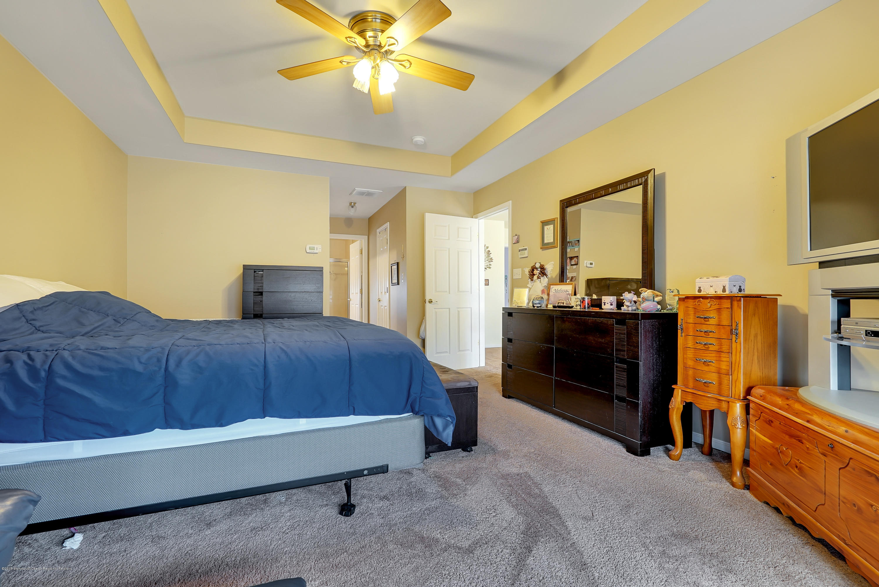 14 Judy Road Eatontown, NJ 07724 - Photo 27 of 38 a bedroom with a bed and wooden floor