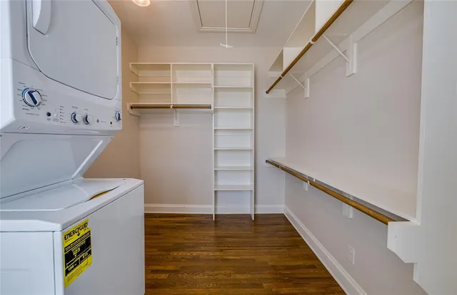 a view of walk in closet with empty racks