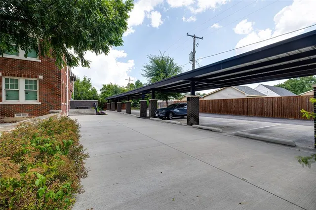 a view of street and electric pole on its side