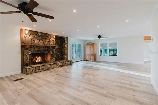 a kitchen with granite countertop a sink and a stove top oven