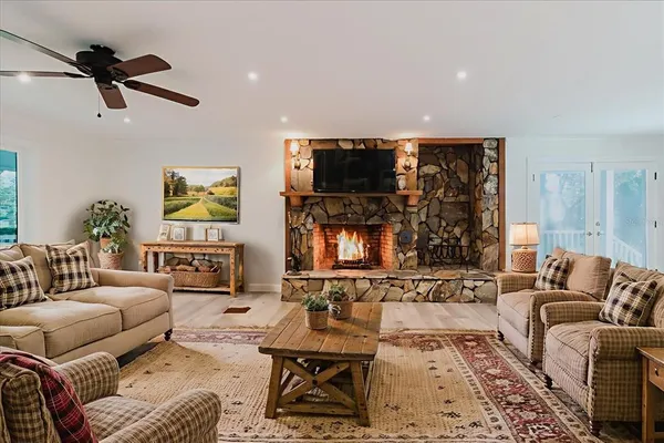 a large kitchen with stainless steel appliances kitchen island a large counter top and a stove