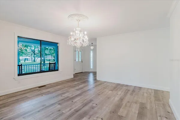 an empty room with wooden floor