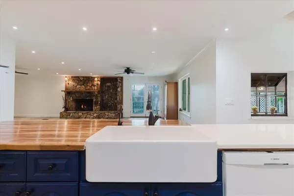 a bathroom with a sink mirror and toilet