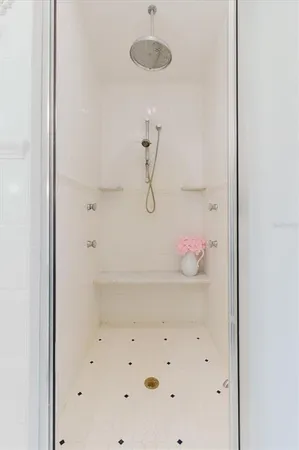 a room with pool table and windows