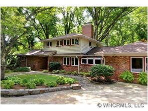 135 Doubleday Road Tryon, NC 28782 - Photo 1 of 12 front view of house with a yard
