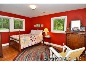 135 Doubleday Road Tryon, NC 28782 - Photo 11 of 12 a bedroom with a bed and window