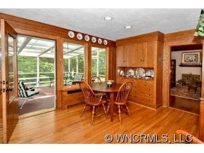 135 Doubleday Road Tryon, NC 28782 - Photo 3 of 12 a view of a dining room with furniture window and outside view