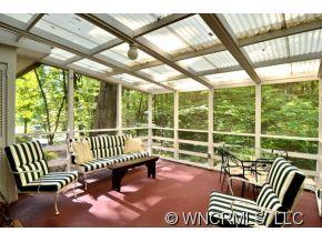 135 Doubleday Road Tryon, NC 28782 - Photo 4 of 12 a view of a porch with furniture