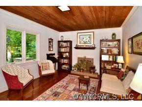 135 Doubleday Road Tryon, NC 28782 - Photo 7 of 12 a living room with furniture a rug and a large window