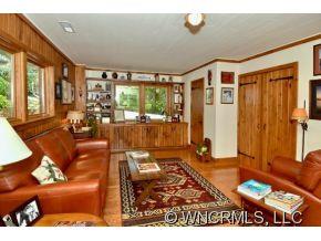135 Doubleday Road Tryon, NC 28782 - Photo 8 of 12 a living room with furniture and a large window